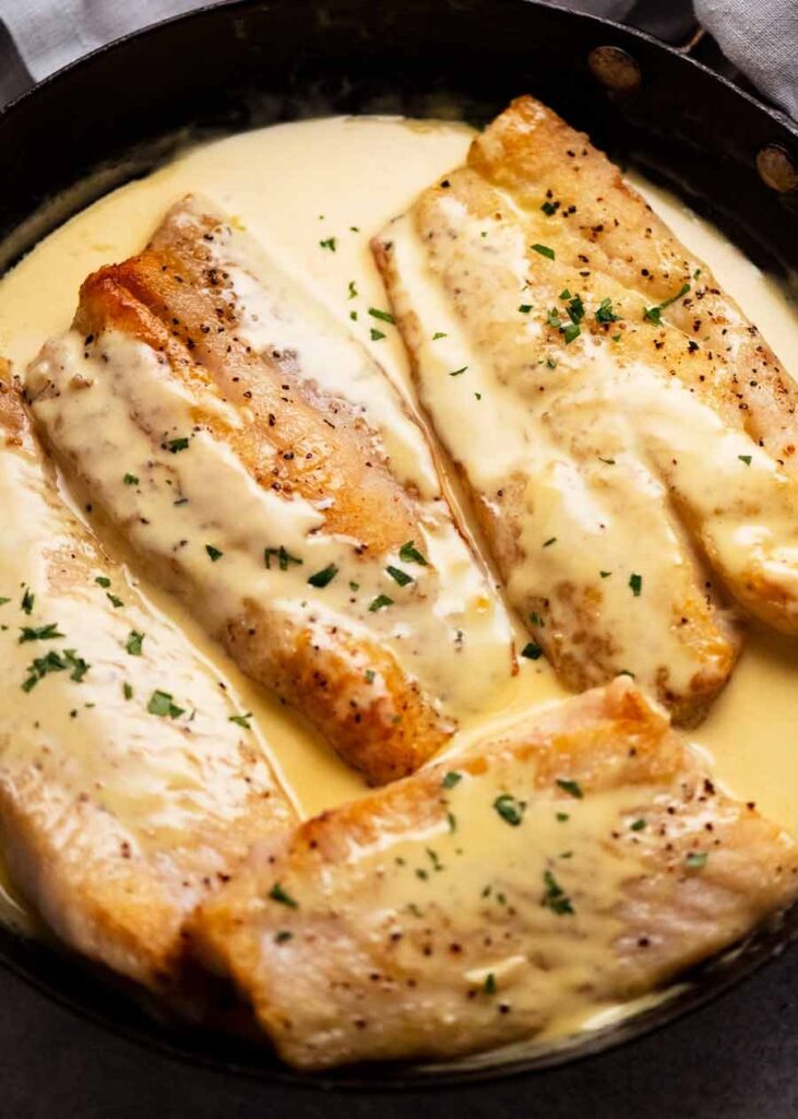 Freshly cooked fish with white wine sauce